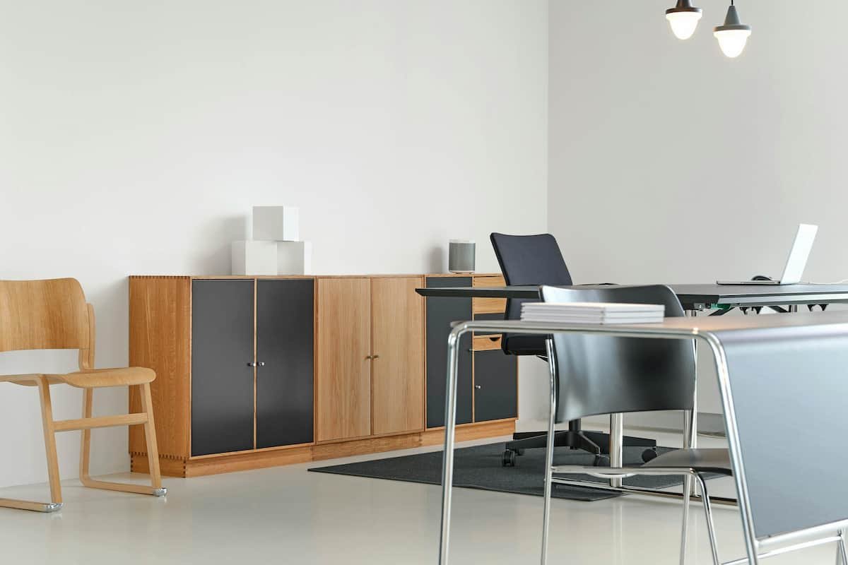 A bright and modern office space with a clean desk, organised furniture, and minimalistic décor.